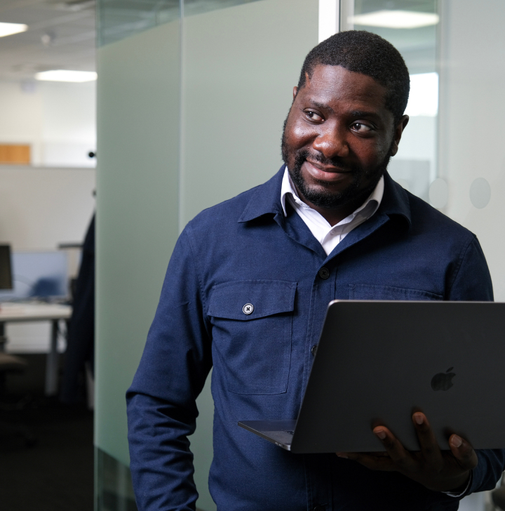 staff member holding a laptop