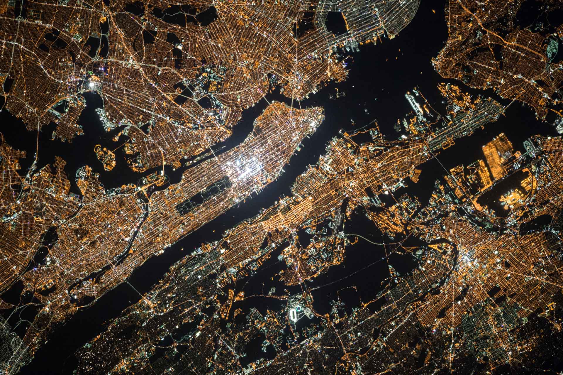 Aerial of manhattan at night with city lights